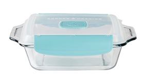Anchor Hocking square cake dish close-up on TrueLock lid release.