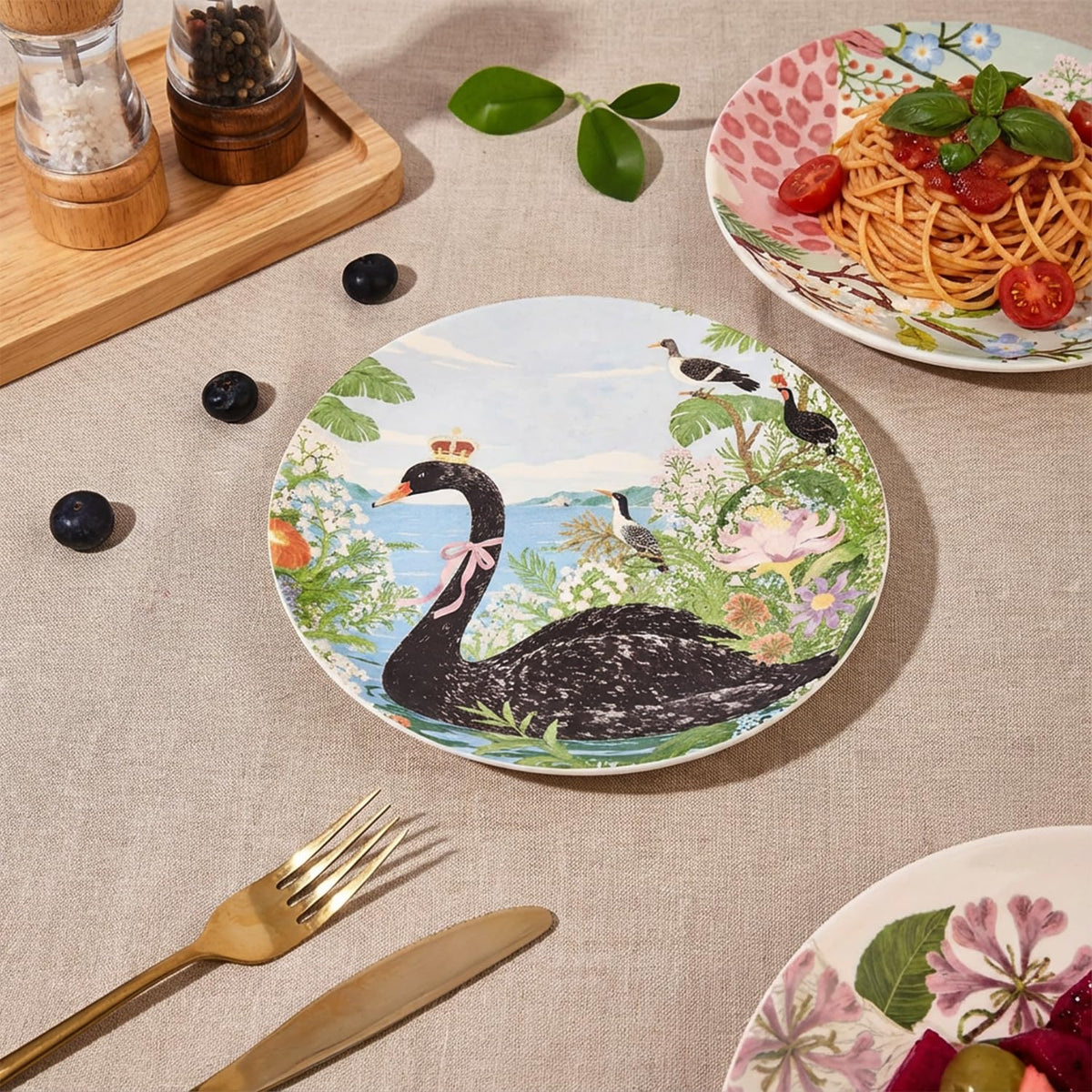 ANCYDPMI black swan design plates add elegant color to sophisticated dining moments.