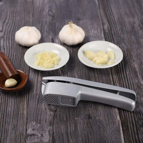 ANERONG garlic press 2-in-1 cleaning tools image, easy residue removal.