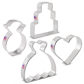 Ann Clark Cookie cutters in action cutting dough into wedding shapes.