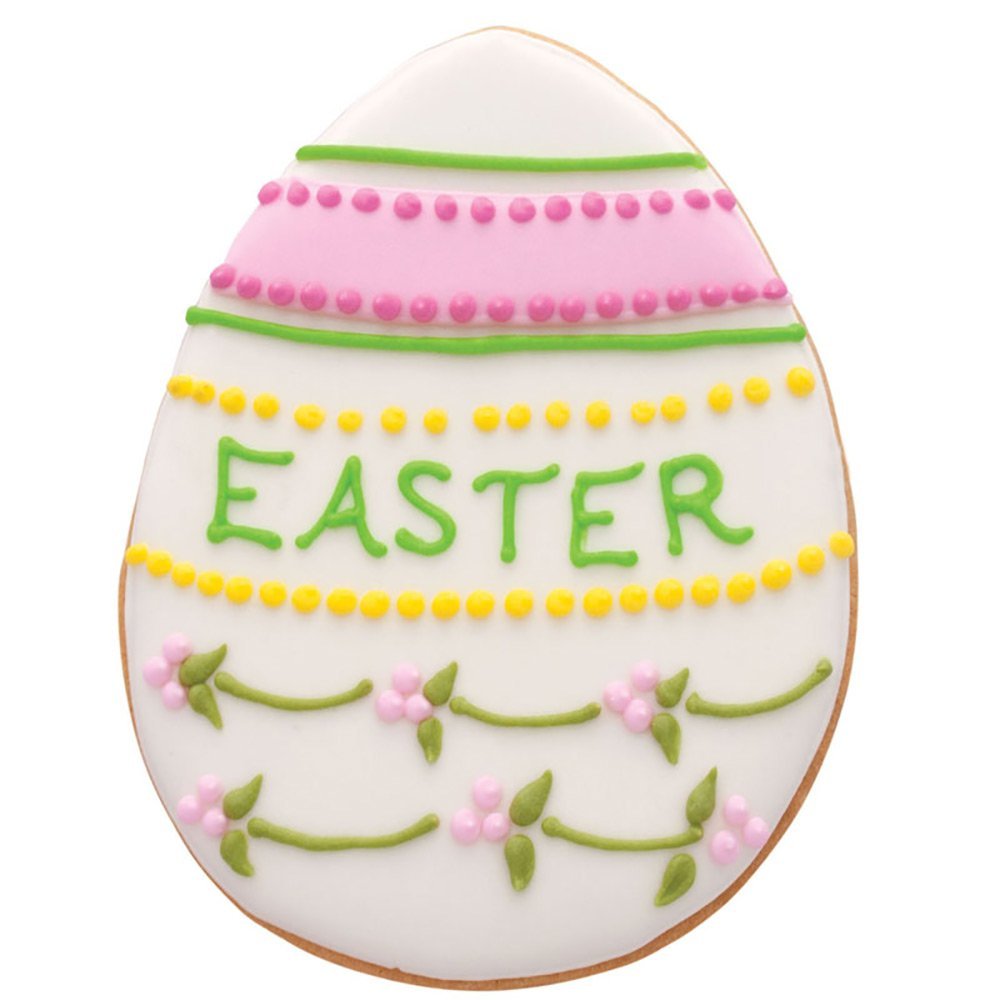 Ann Clark Easter decorating setup with icing and sprinkles for vibrant cookies.
