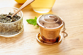 Gift-ready Apace Living tea infuser set in elegant packaging.