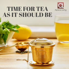 Apace Living tea scoop placed beside the infuser for measurement.