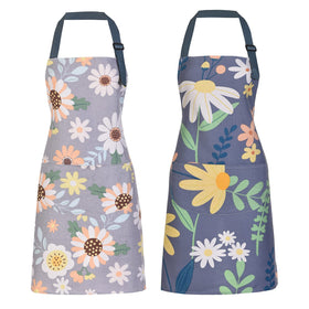 ARBINSON floral apron close-up: soft cotton texture with green leaves for durable comfort.