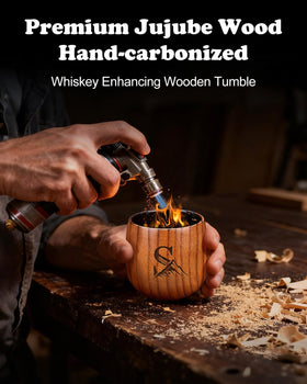 Hand holding Argefkeen charred wooden whiskey glass with comfortable grip