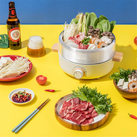 AROMA AMC-130 stainless pot for even heating and easy cleanup.