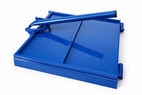 Artisan Fire 12-inch tortilla press on blue flat surface for evenly thick tortillas.