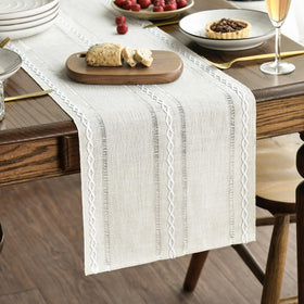 Artoid Mode beige rustic table runner with embroidery adds warm texture to family meals.