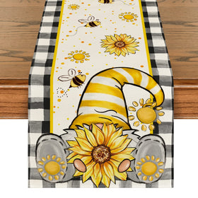 Artoid Mode buffalo plaid sunflower gnomes table runner on a festive table