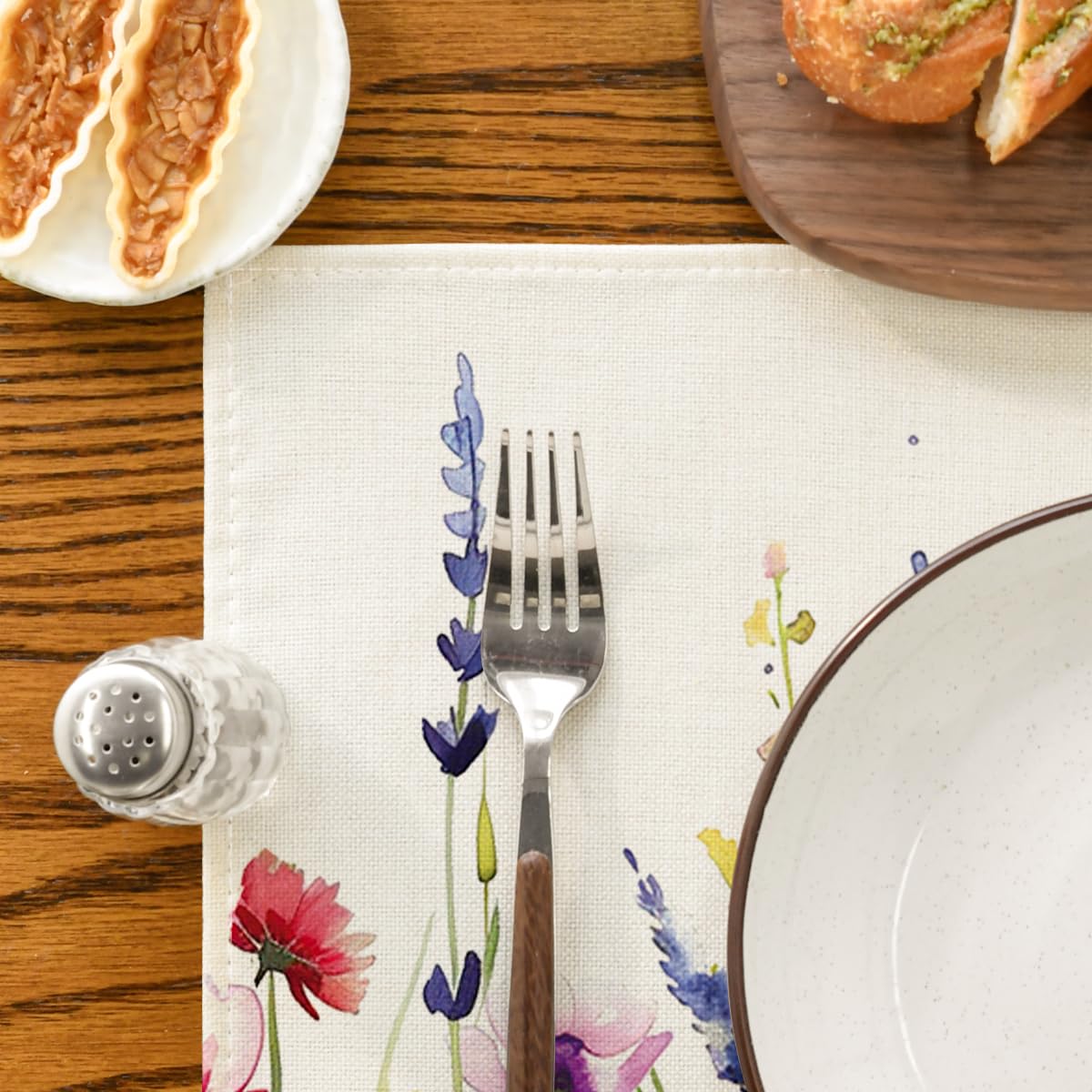 Artoid Mode daisy-lavender placemat makes table settings feel seasonal.