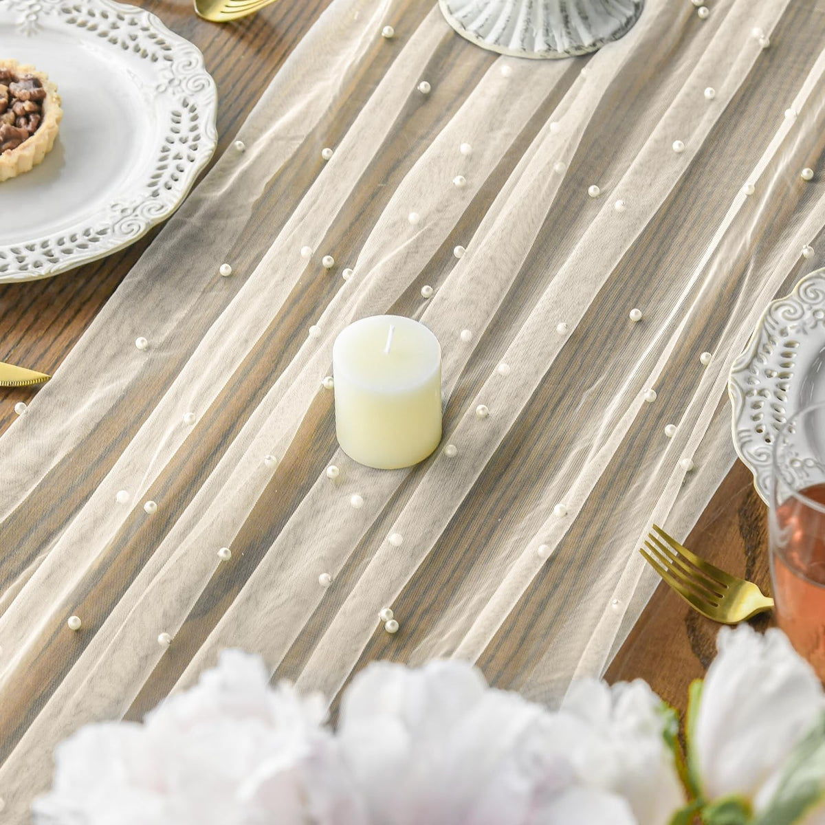 Artoid Mode dining table setup with gauze runners for elegant place settings.