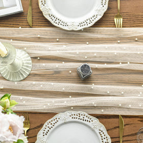 Artoid Mode pearl beige gauze runner on a full table for festive dining.