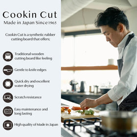 Asahi Cookin Cut rubber cutting board side profile shows slim 0.5 inch thickness for easy storage.