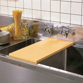 Asahi Cookin Cut rubber cutting board surface closeup emphasizes slip resistance and cleanability.