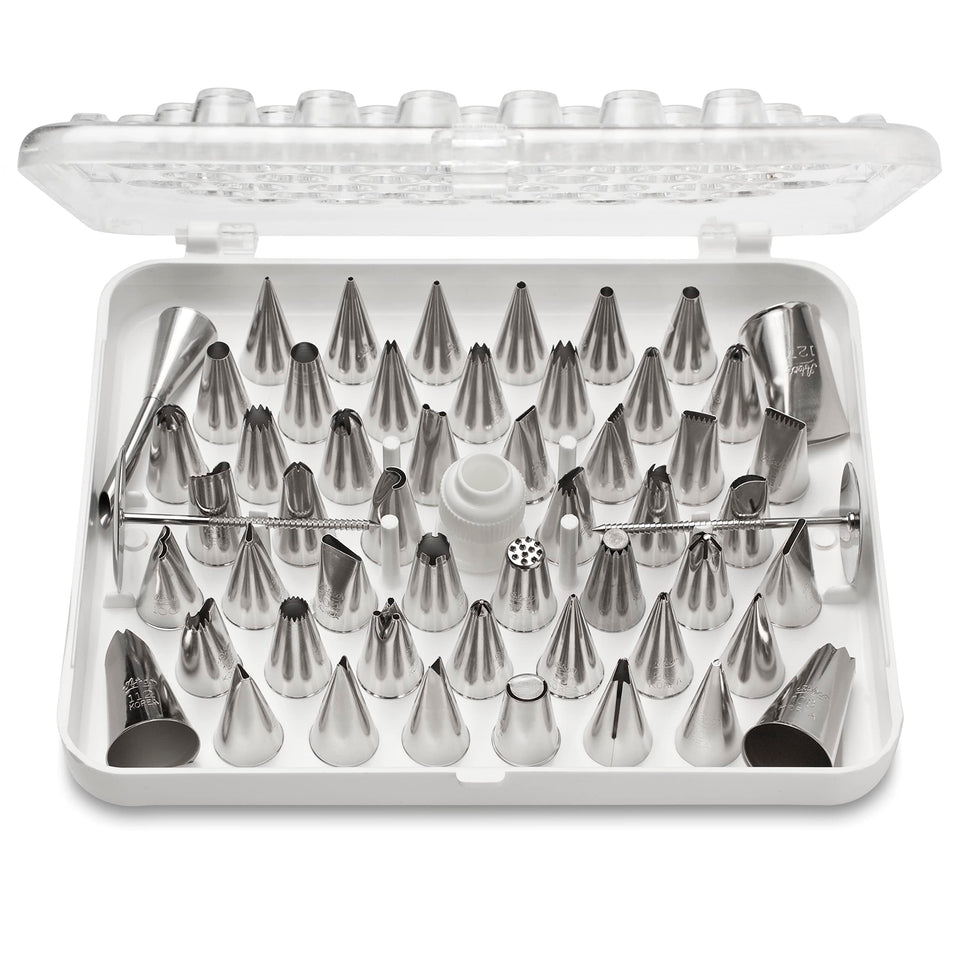 Ateco 52-piece cake decorating tubes stored in hinged storage box for organized decorating