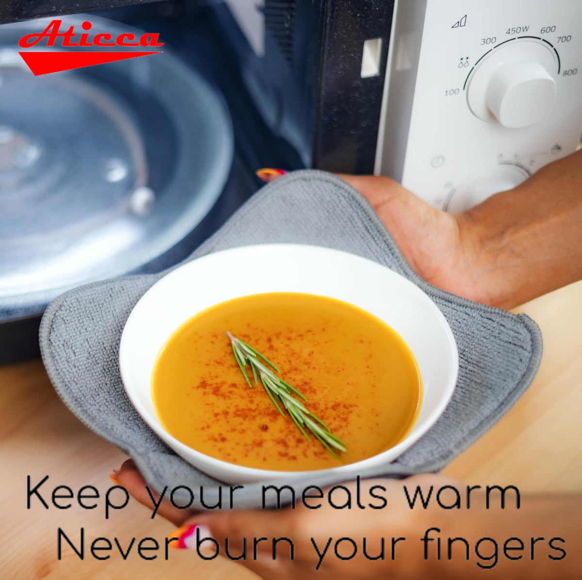 Aticca bowl cozy holder in use demonstrates easy removal without burns.