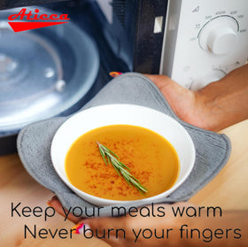 Aticca bowl cozy holder in use demonstrates easy removal without burns.
