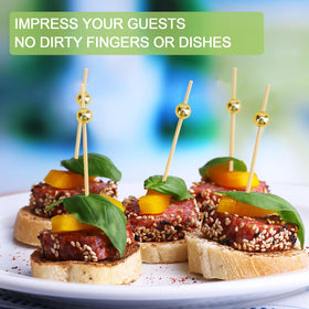 ATZNZIK charcuterie board decoration with gold skewers for hors d'oeuvres.