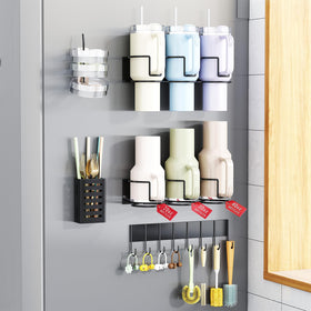Aufworld magnetic cup holder mounted on fridge securing Stanley cups.