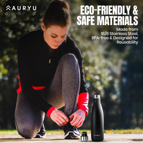 Auryu leak-proof bottle in rugged setting shows durability on the go