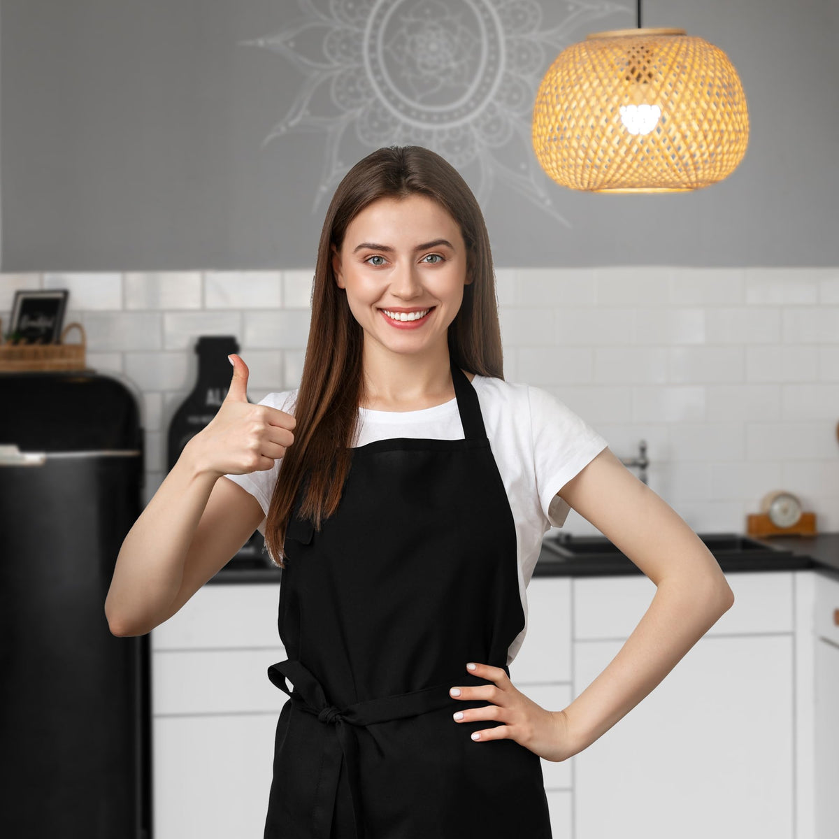 Avalon Kitchen black apron with durable stitching detail across chest.