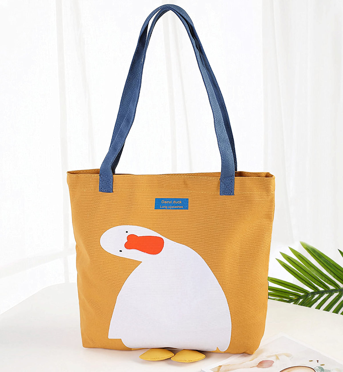 AWXZOM tote with shoulder strap for easy carrying.