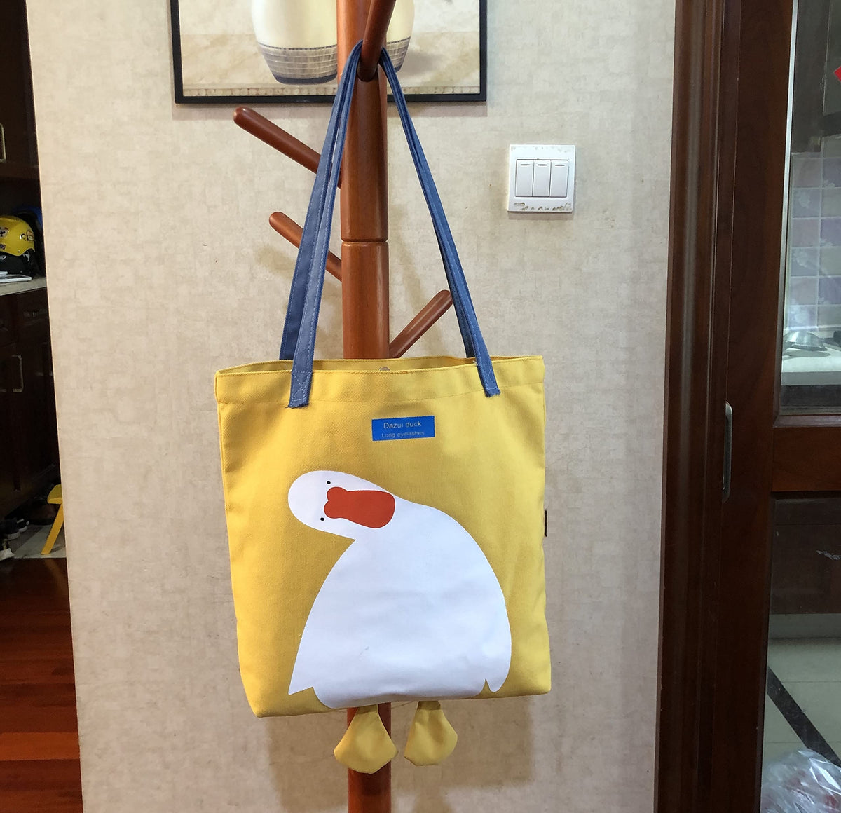 AWXZOM tote size 14.96 by 3.93 by 13.38 inches.