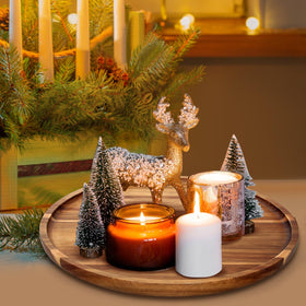Ayiaren acacia round tray used as a candle holder for cozy ambience.