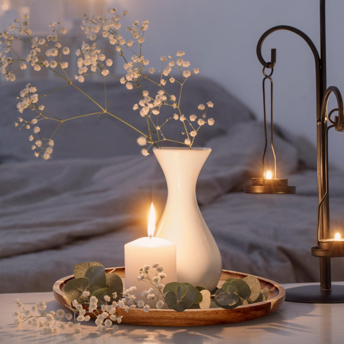Ayiaren acacia round tray styled as a dining room centerpiece with plants.