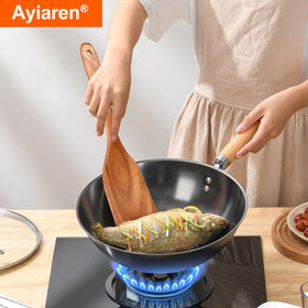 Ayiaren teak spatula scraper shown for gentle deglazing and scraping residues.