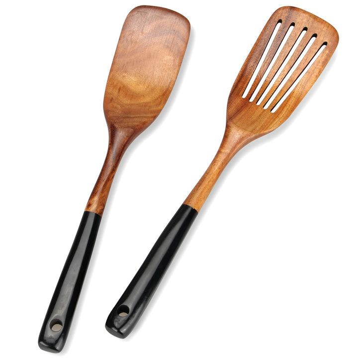 Ayiaren teak spatula with slotted design for easy flipping and draining.