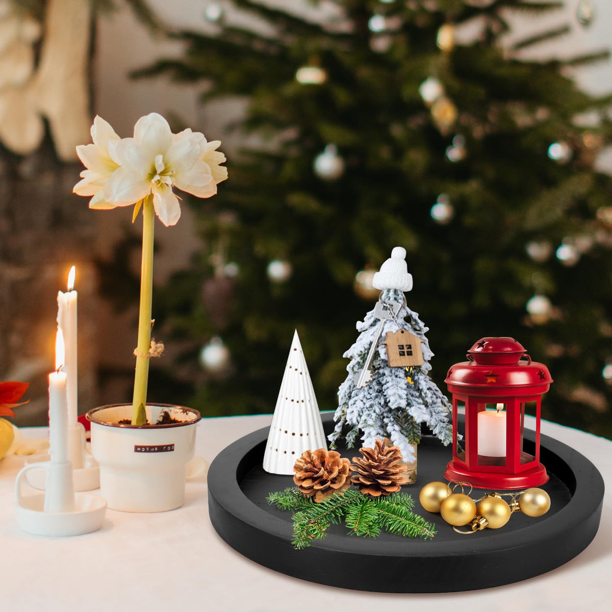Ayiaren wooden serving tray used as a candle holder with small plant accents.