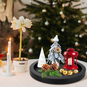 Ayiaren wooden serving tray used as a candle holder with small plant accents.