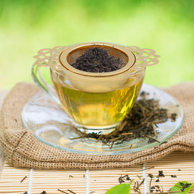 Aynaxcol tea strainer crown pattern adds elegant touch to any teapot.