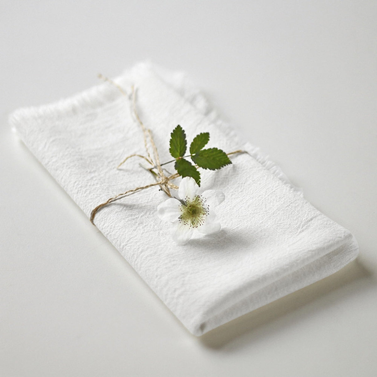 Ayuzawa 18x18 fringe white napkin showcasing hotel-style service at home