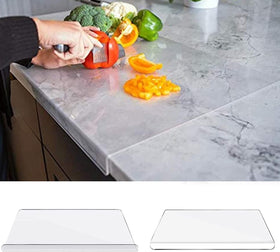 AZM Displays lip-protecting cutting board guards countertops during prep.