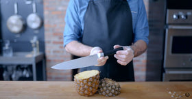 Babish 8-Inch Chef Knife full tang in hand offers steady maneuverability.