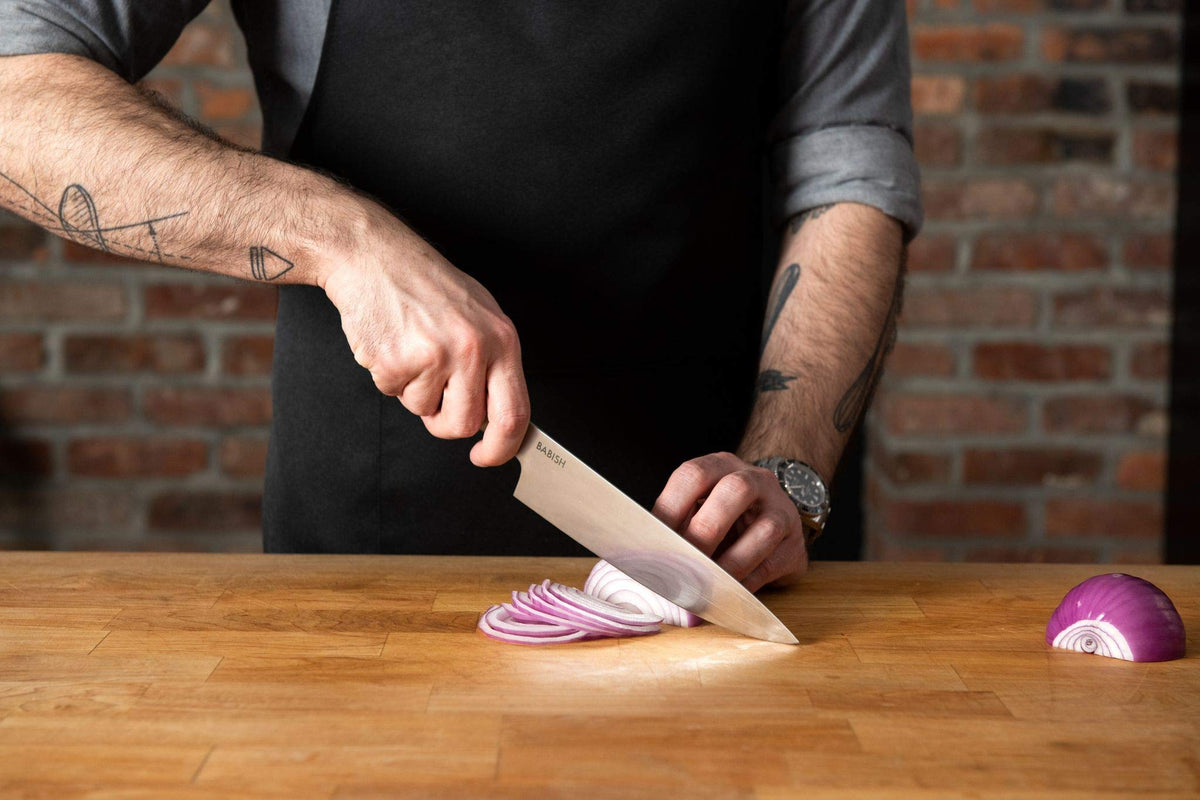 Babish 8-Inch Chef Knife meat slicing delivers clean cuts on proteins.