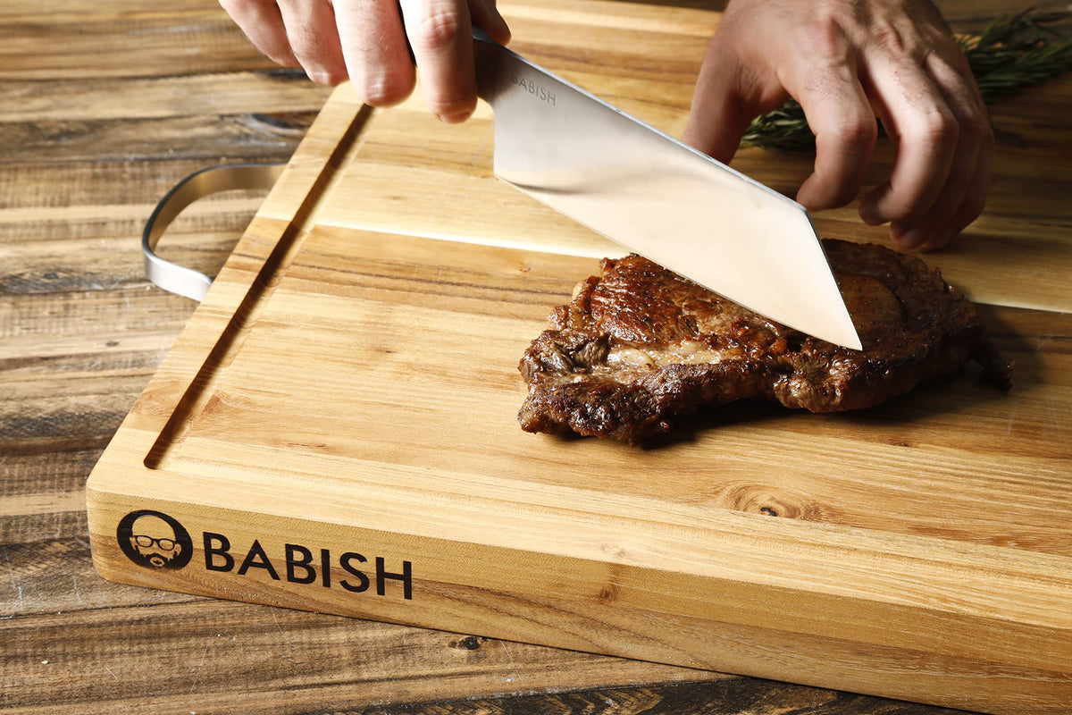 Babish Clef diced vegetables demonstrate efficient transfer from board to pan.