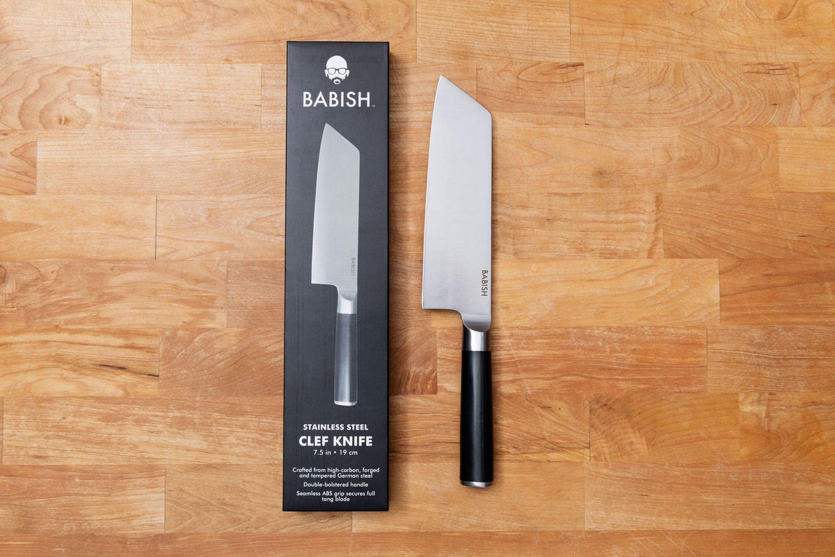 Babish Clef hybrid design in action for precise chopping and scooping.