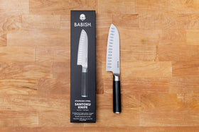 Babish Santoku with granton edge reduces drag for smooth slicing.