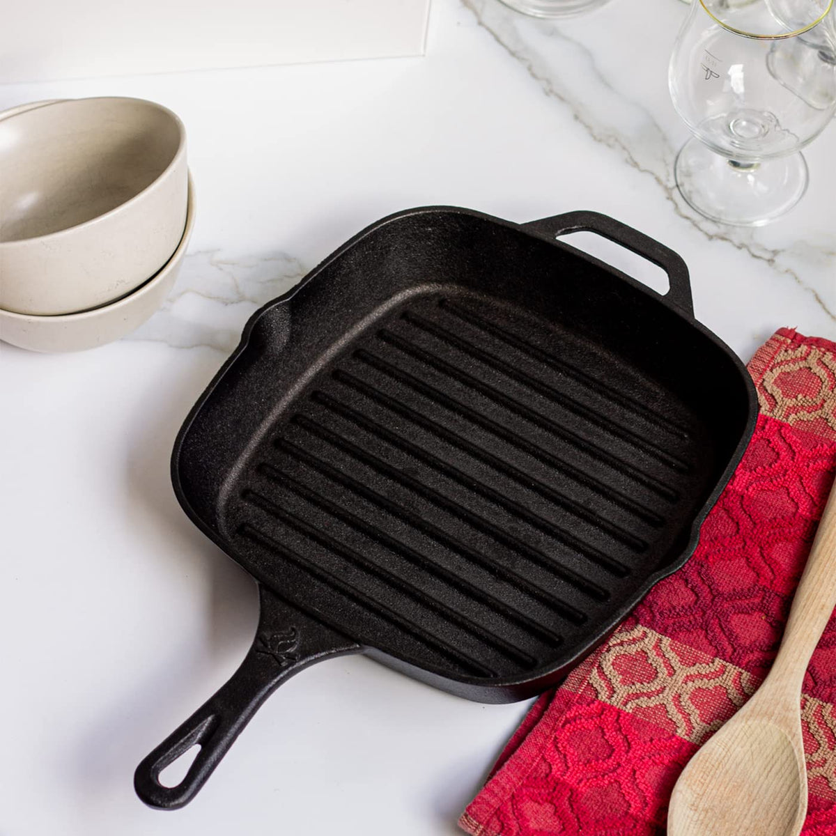 Backcountry Iron pan includes protective mitt for safe handling.