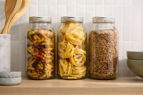 Ball half-gallon jars prepared for gifting homemade treats.
