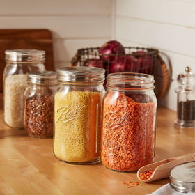 Ball one-piece lids with gasket for secure seals and durability