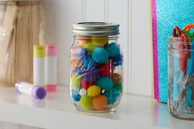 Ball regular-mouth pint jars ideal for canning sauces and preserving.