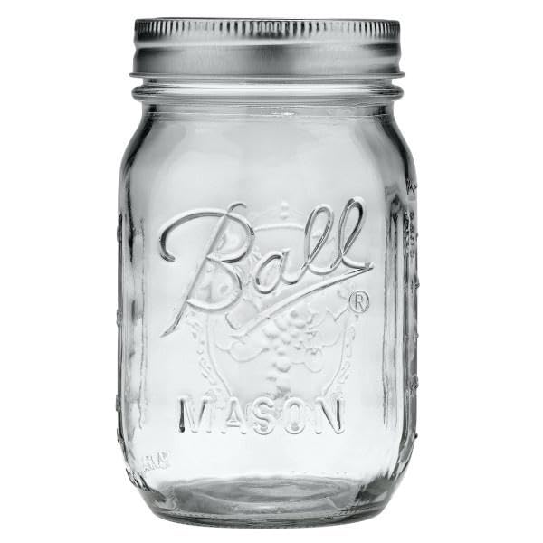 Close-up of Ball regular-mouth pint jar lids and bands for secure sealing.