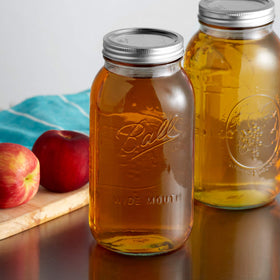 Ball wide-mouth jar lid off shows clear glass perfect for labeling.