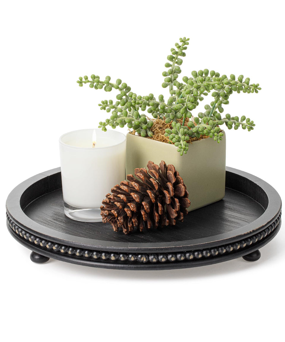 Bamboo Land round tray with tripod base for stable hosting on a coffee table.