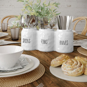 Barnyard Designs ceramic utensil holder adds rustic charm while organizing flatware neatly.