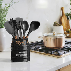 Vintage-inspired ceramic utensil holder enhances kitchen decor while keeping tools within reach